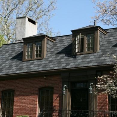 Red brick house with dark grey slate roof