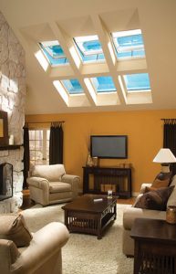 The inside of a home brightly lit by skylights.