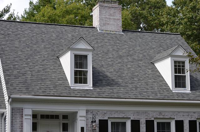 A home in Wellesley after O'lyn Roofing crews installed a new architectural shingled roof.