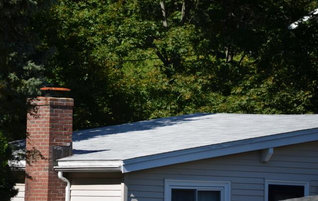 An after picture of a low pitch roof installation in Newton.
