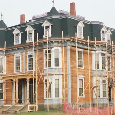 A Victorian home being worked on by O'lyn Roofing.