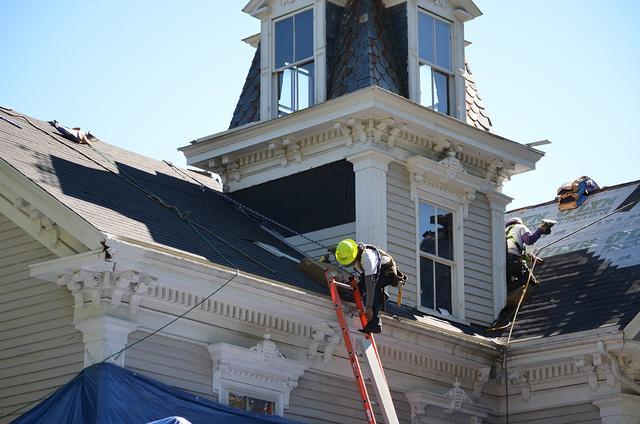 An O'lyn Roofing crew working on a home in Belmont, MA.