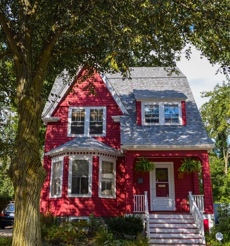 Image of a red home after work was done by O'lyn Roofing.