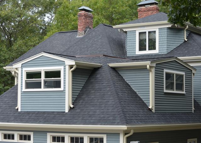 A home in West Roxbury after O'lyn Roofing installed new asphalt shingles.