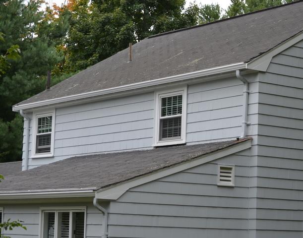 Before image of a home in Needham with a roof in need of replacement.