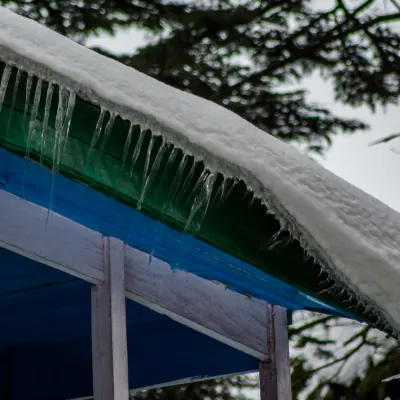 Snow and ice forming the roof of house