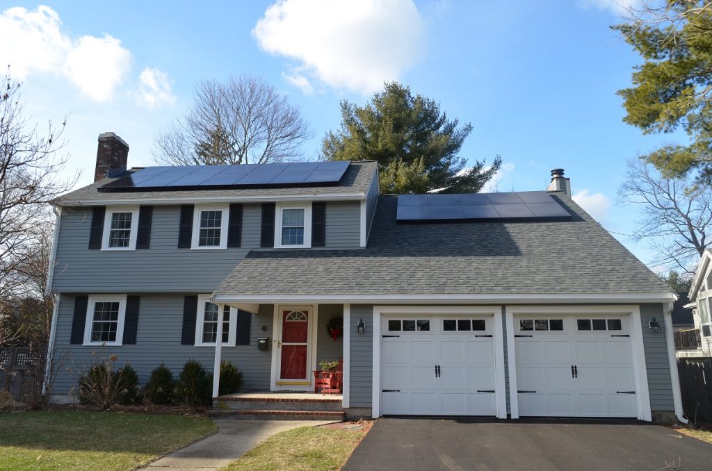 Blue house solar panels installed by O'lyn