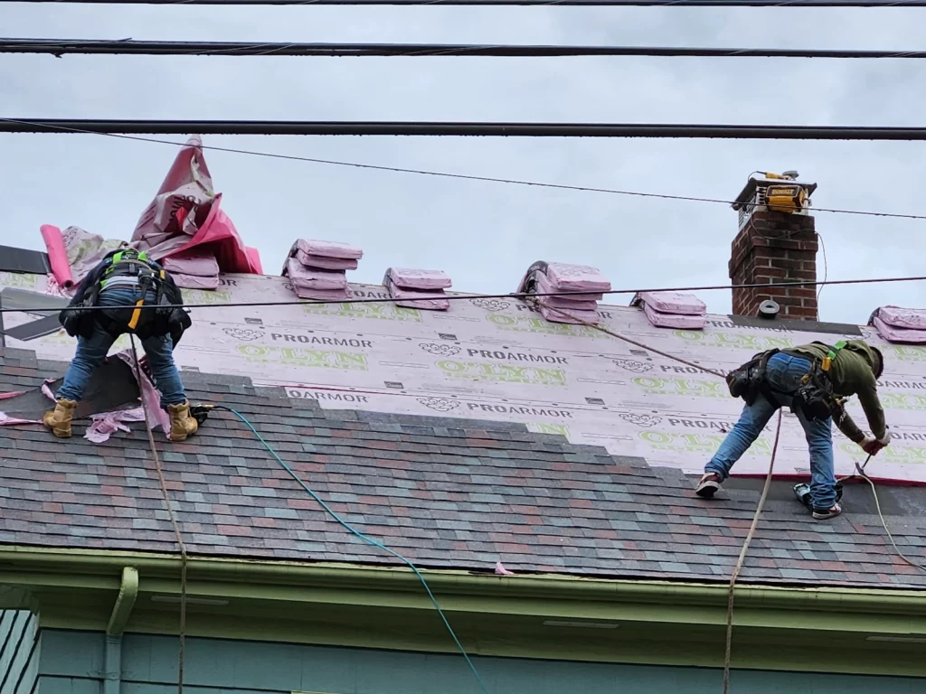 O'lyn Roofing Crew Working on Roof  Replacement