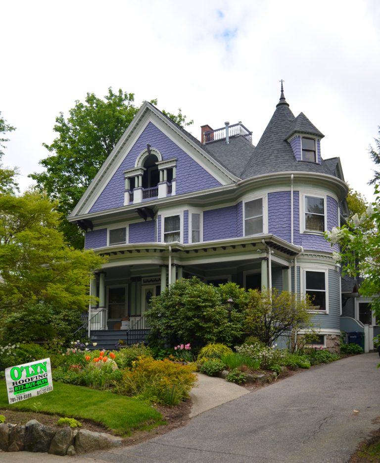  A purple house with a new gutter system. 