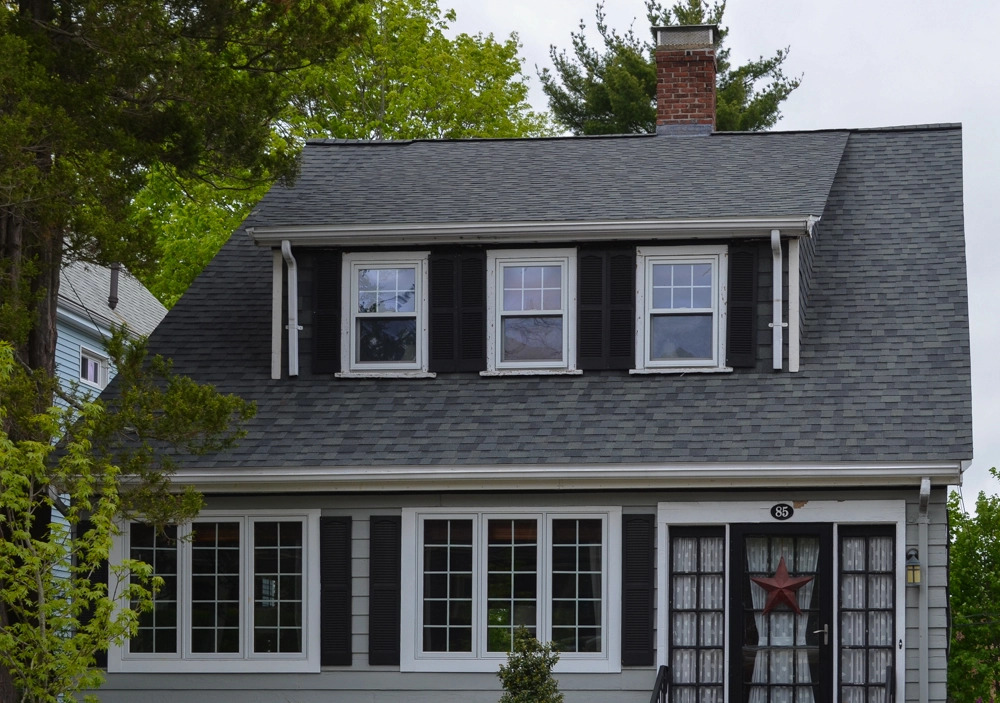  A home with new gutters and CertainTeed roofing materials installed. 