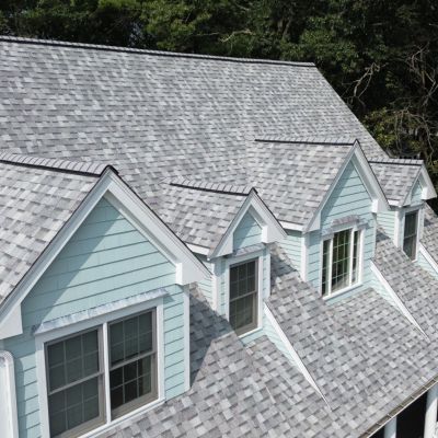 New asphalt on light blue sided home