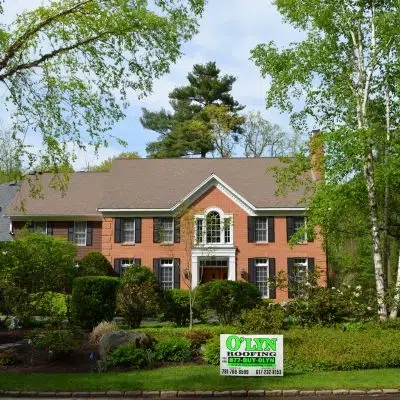 Residential home with new shingle roof courtesy of O'LYN Roofing