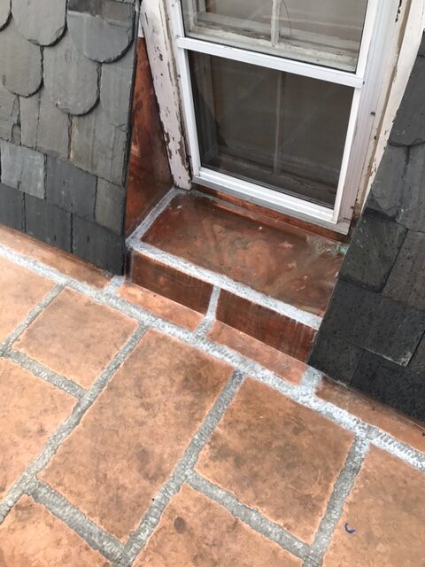 copper flashing around window with slate mansard